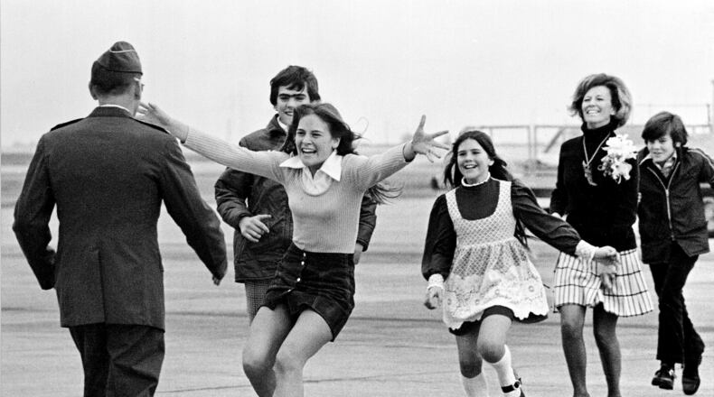 FILE - Released prisoner of war Lt. Col. Robert L. Stirm is greeted by his family at Travis Air Force Base in Fairfield, Calif., as he returns home from the Vietnam War, March 17, 1973. (AP Photo/Sal Veder, File)