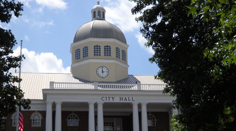 Roswell has changed the way it figures its occupation tax to a method that’s expected to increase revenues from $800,000 to more than $2 million a year. AJC FILE