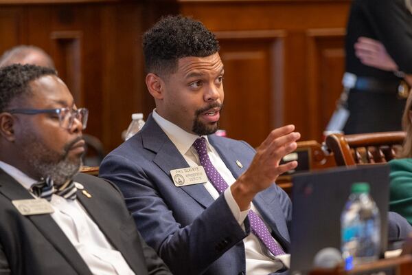 State Rep. Phil Olaleye (center), D-Atlanta, is seen during discussion of school safety bill HB 268 at the House in the Capitol in Atlanta on Tuesday, March 4, 2025. The bill, developed in the aftermath of the 2024 shooting at Apalachee High School, would track and share behavioral health information about students. (Arvin Temkar / AJC)