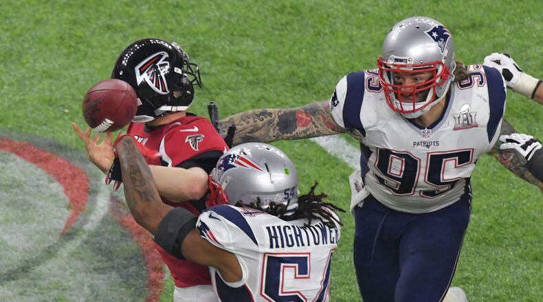 February 5, 2017 Houston, TX - Atlanta Falcons quarterback Matt Ryan (2) is sacked by New England Patriots middle linebacker Dont’a Hightower (54) and New England Patriots defensive end Chris Long (95) in the fourth quarter at NRG Stadium in Houston, TX, on Sunday, February 5, 2017. HYOSUB SHIN / HSHIN@AJC.COM