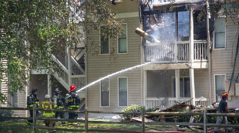 Sandy Springs firefighters worked to control a blazing fire at Azalea Park apartment complex in June. Everyone made it out safe and unharmed. (Katelyn Myrick/katelyn.myrick@ajc.com)