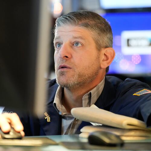 Michael Gallucci works on the floor at the New York Stock Exchange in New York, Wednesday, Dec. 10, 2025. (AP Photo/Seth Wenig)