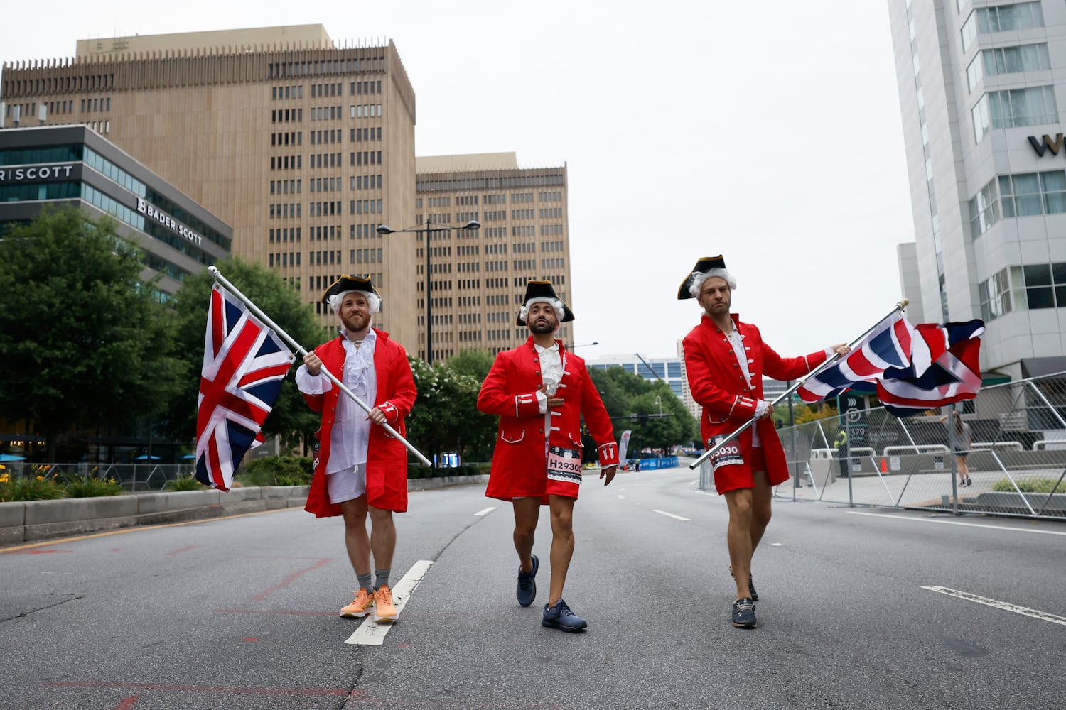 Runners on Peachtree Street during the 54th running of the Atlanta Journal-Constitution Peachtree Road Race on Tuesday, July 4th, 2023.   (Miguel Martinez / Miguel.MartinezJimenez@ajc.com)