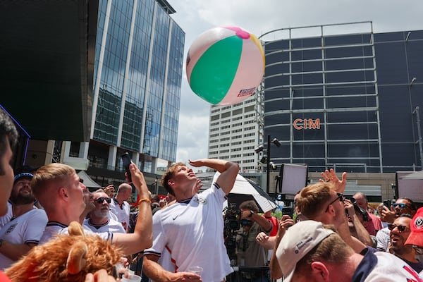 England fans celebrate with a beach ball at Irish Exit before the FIFA World Cup game against Argentina in Atlanta on July 15, 2026. It’s the last World Cup game Atlanta is hosting. (Arvin Temkar/AJC)