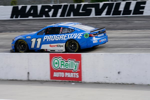 Denny Hamlin drives into Turn 2 during a NASCAR Cup Series auto race in Martinsville, Va., Sunday, March 30, 2025. (AP Photo/Chuck Burton)