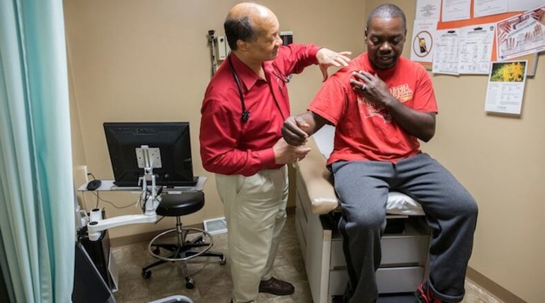 Dr. James Jackson, MD, examines Matthew Shorter, 51, a medicaid patient enrolled in the Healthy Indiana Plan (HIP), at the Heart City Health Center on Thursday, June 4, 2015 in Elkhart, Ind. (Zbigniew Bzdak/Chicago Tribune/TNS)