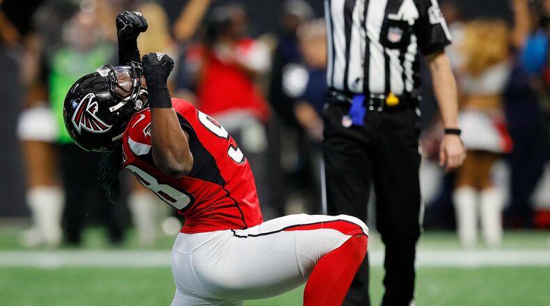Atlanta Falcons Takkarist McKinley celebrates a sack during the first half against the Minnesota Vikings at Mercedes-Benz Stadium on Dec. 3, 2017, in Atlanta.