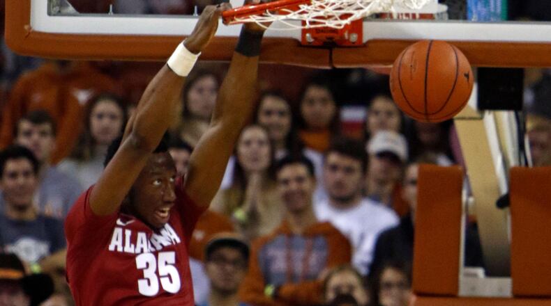 Alabama forward Donta Hall dunks the ball during the first half of an NCAA college basketball game against Texas, Friday, Dec. 2, 2016, in Austin, Texas. (AP Photo/Michael Thomas)