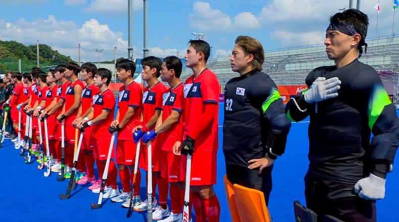 In this image made from video, South Korean men's field hockey players react as the North Korean national anthem is played ahead of their game against Bangladesh at the Asian Games in Kakamigahara city, Gifu prefecture, Japan, Friday, Sept. 18, 2026. (OCA/SNTV via AP)