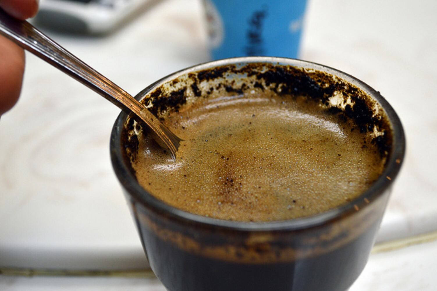 This is called "breaking the crust" where the grounds and water interact. The coffee is most aromatic, so this is a good time to assess scent.