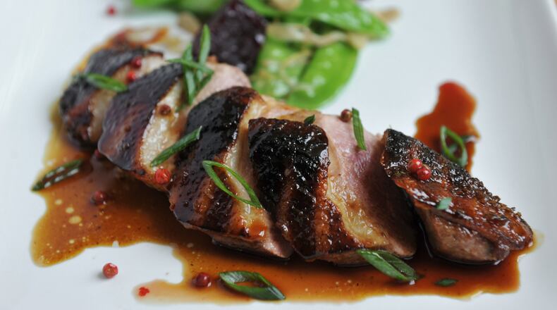 Ration & Dram’s smoked duck breast is served with snap peas, quick-pickled beets, green garlic and smoky duck jus. (Beckysteinphotography.com)