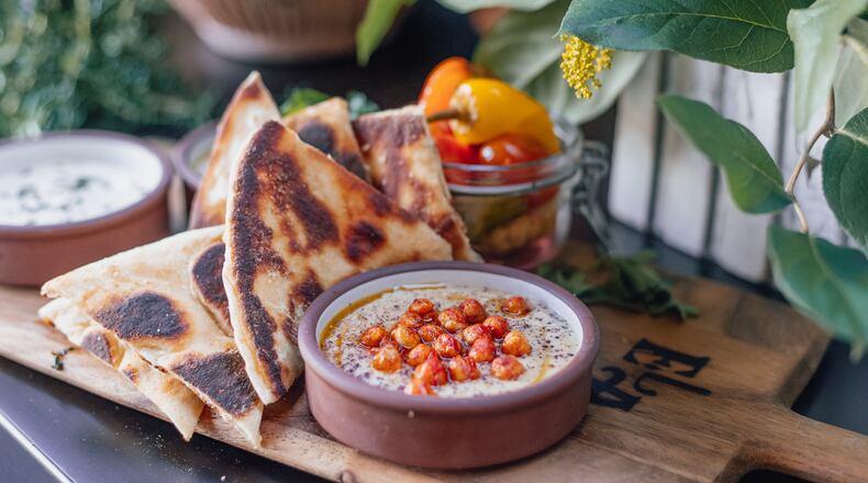 Ela offers three hummus options, including this one featuring crispy chickpeas and sumac. The trio also is available as a $15 sampler, with grilled pita. Courtesy of Frankie Cole
