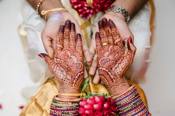 This May 2023 photo shows a bride's hands covered in mehndi in Addison Park, N.J. (Alexander Mai of Omne Amor via AP)