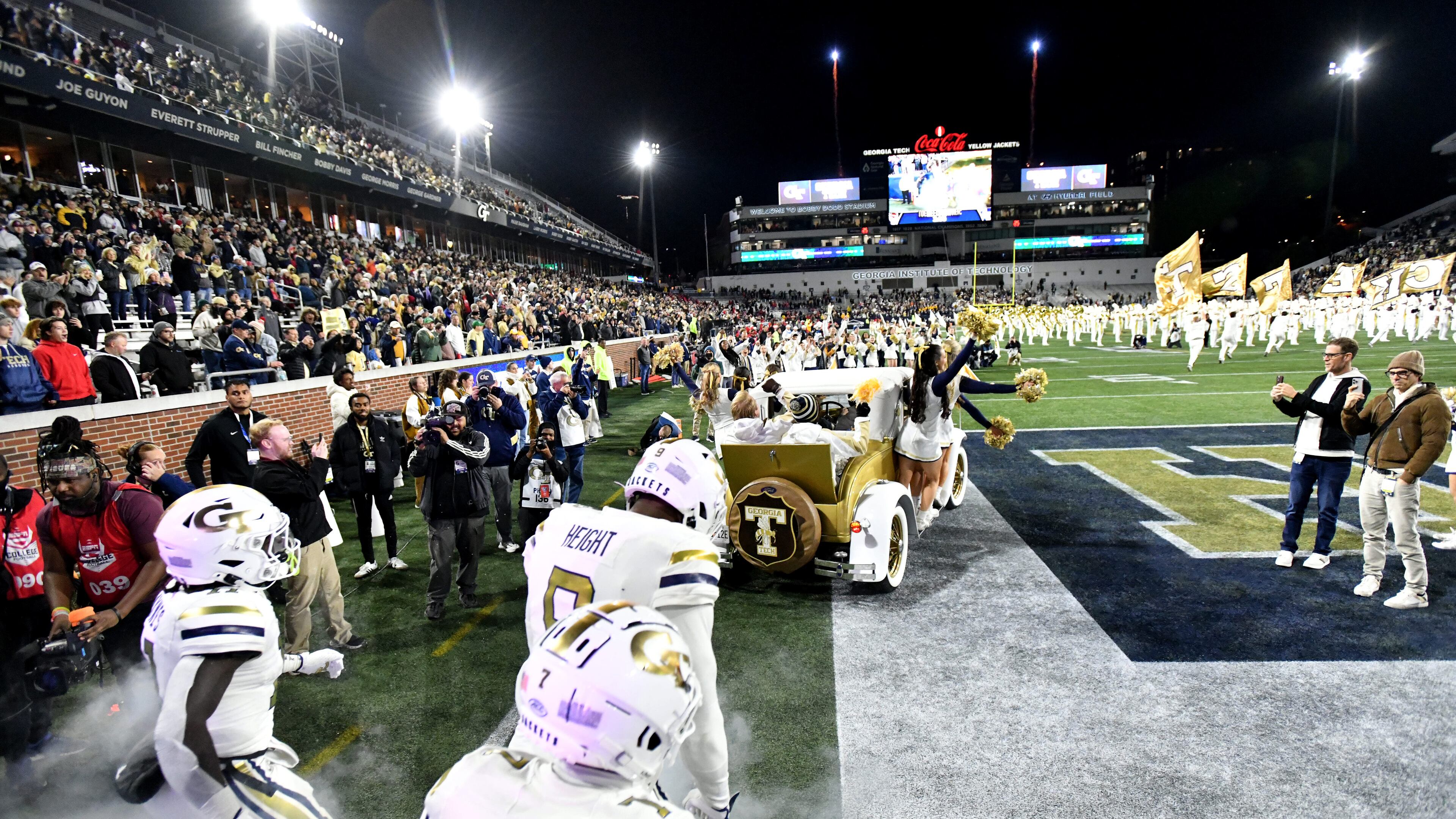 Georgia Tech players run onto the football field before an NCAA college between Georgia Tech and North Carolina State at Bobby Dodd Stadium, in Atlanta, 2024. (Hyosub Shin/AJC)