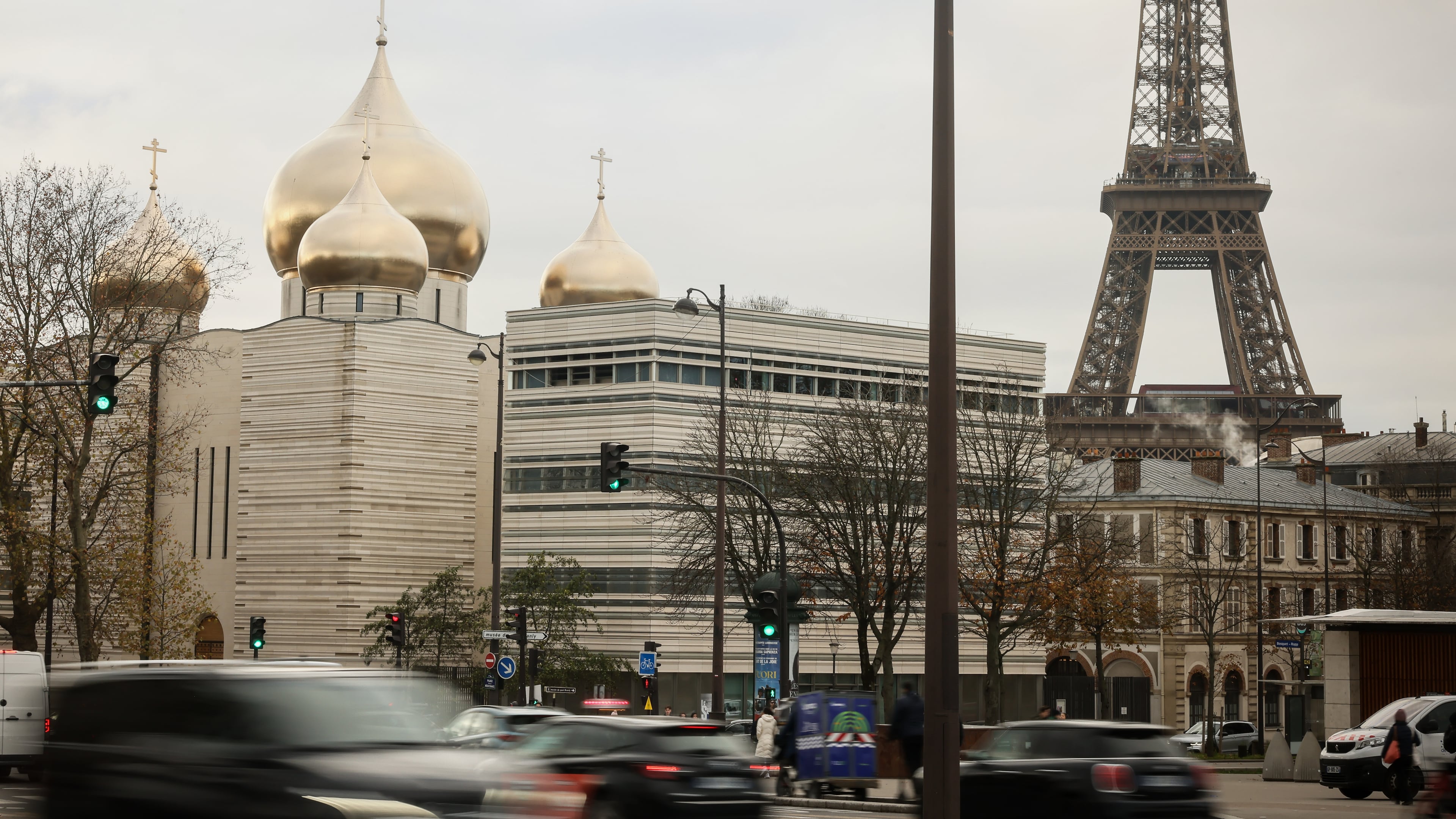 The Holy-Trinity Russian orthodox Cathedral and the adjoining culture center, right, are seen next to the Eiffel Tower in Paris, Wednesday, Nov. 26, 2025. (AP Photo/Thomas Padilla)