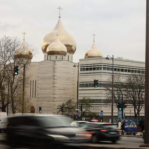 The Holy-Trinity Russian orthodox Cathedral and the adjoining culture center, right, are seen next to the Eiffel Tower in Paris, Wednesday, Nov. 26, 2025. (AP Photo/Thomas Padilla)
