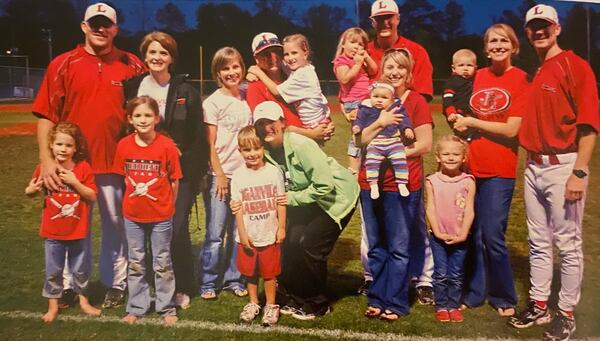 Loganville baseball head coach Bran Mills (far right), former assistant coach Jeff Segars (middle left) and two other Loganville assistants stand with their families after a baseball game in 2012. At the time, Segars was Loganville's head coach, and Mills was one of his assistants. (Photo Courtesy/Bran Mills)