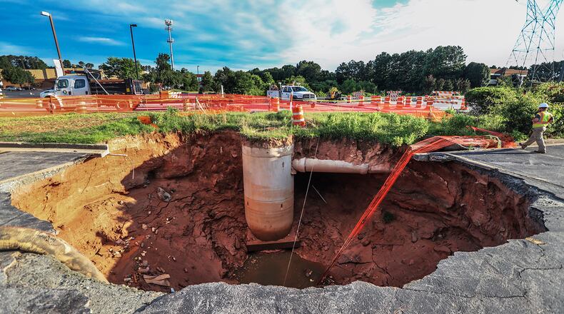 Two sinkholes opened on Venture Drive near Gwinnett Place Mall due to a leaking drainage pipe, seen in this June 22, 2018 photo.