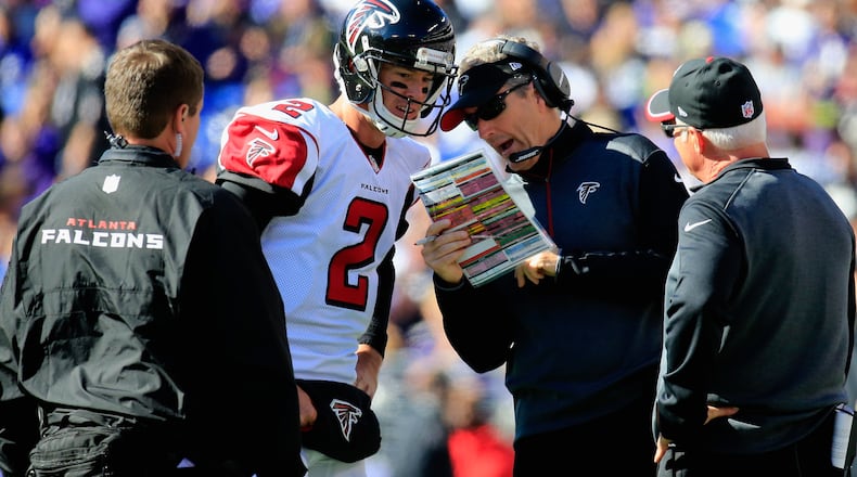 Former Falcons offensive coordinator Dirk Koetter, here with Matt Ryan and former Falcons coach Mike Smith (right), was fired as head coach at Tampa Bay. (Rob Carr/Getty Images