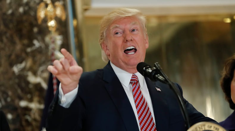 President Donald Trump in the lobby of Trump Tower on Tuesday, Aug. 15, 2017. AP Photo/Pablo Martinez Monsivais