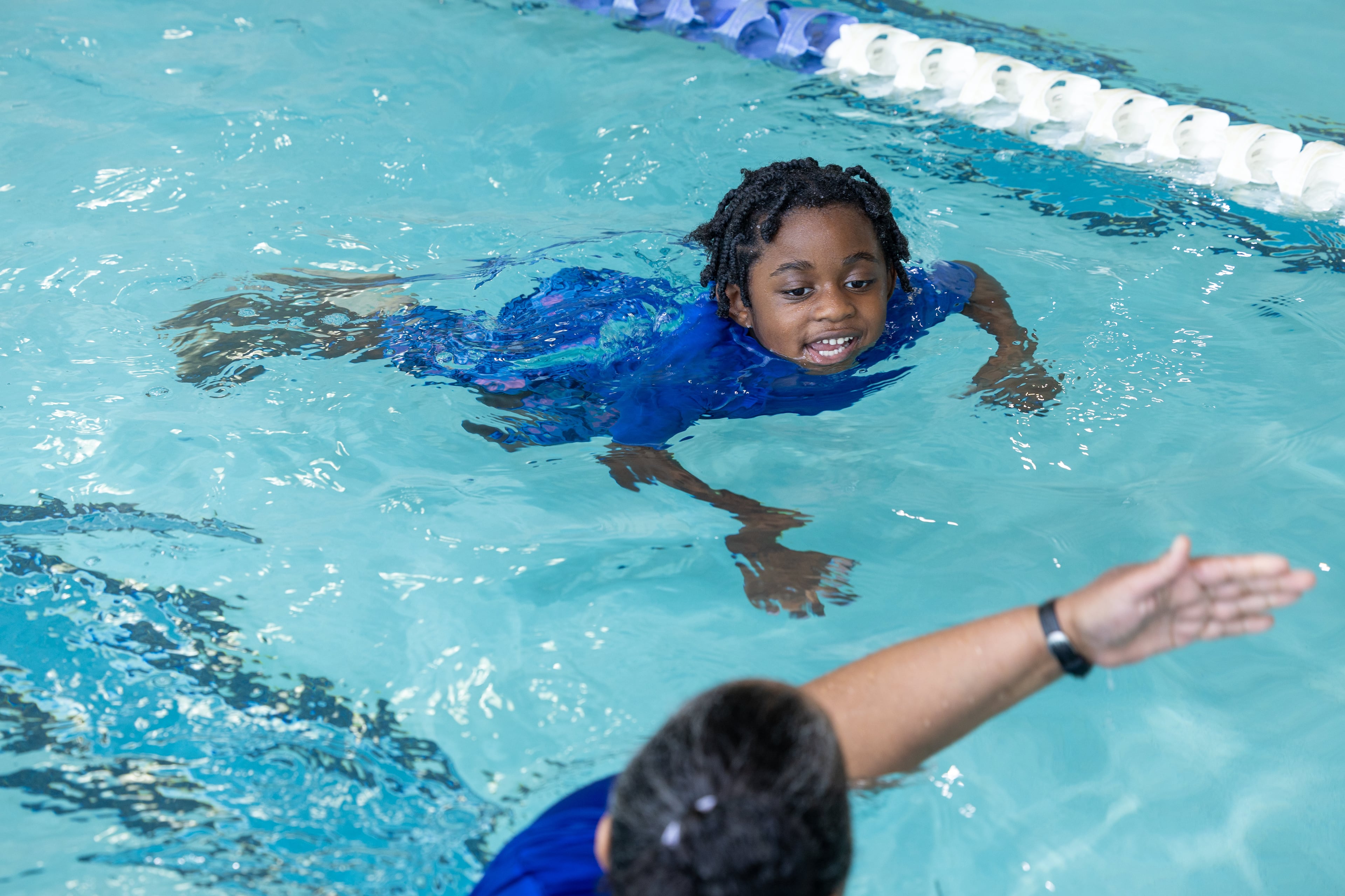 Mom Cassandra Davis said Lewis Davis, almost 5 now, has blossomed since beginning adaptive swim lessons at age 3. (Phil Skinner for the AJC)