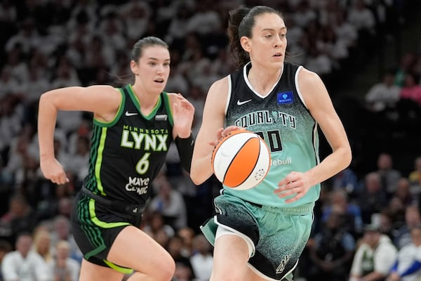 FILE - New York Liberty forward Breanna Stewart drives to the basket past Minnesota Lynx forward Bridget Carleton (6) during the first half of Game 4 of a WNBA basketball final playoff series, Friday, Oct. 18, 2024, in Minneapolis. (AP Photo/Abbie Parr, File)