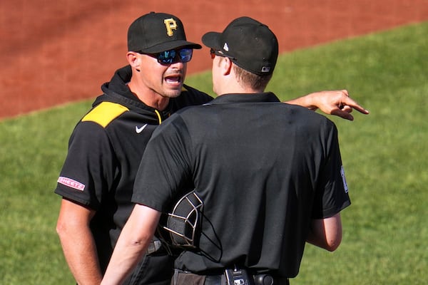 Pittsburgh Pirates manager Don Kelly, left, makes his point to umpire Clint Vondrak after being ejected during the sixth inning of a baseball game against the Atlanta Braves in Pittsburgh, Saturday, May 10, 2025. (AP Photo/Gene J. Puskar)