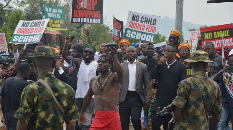 People protest demanding government to rescue the school children that were recently kidnapped in various part of the country, on the street of Abuja, Nigeria. Thursday, June 4, 2026. (AP Photo/Olamikan Gbemiga)