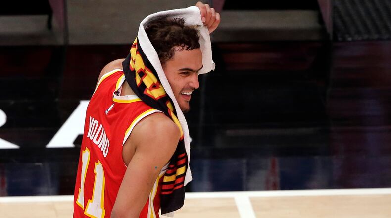 Trae Young (11) reacts after the win over the Washington Wizards in an NBA basketball game Wednesday, May 12, 2021, in Atlanta. Atlanta Hawks defeated the Washington Wizards 120-116.
