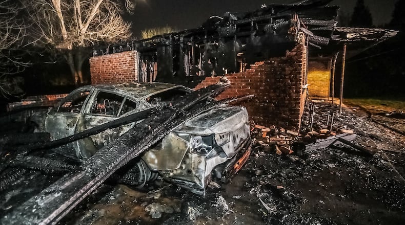 A fire engulfed a home and a vehicle on Macon Drive in southwest Atlanta on Tuesday morning.