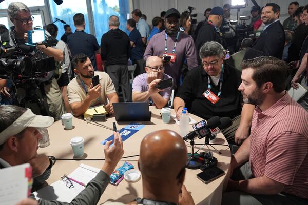 Tennessee Titans head coach Brian Callahan, right, is interviewed at the NFL football annual meetings Monday, March 31, 2025, in Palm Beach, Fla. (AP Photo/Lynne Sladky)