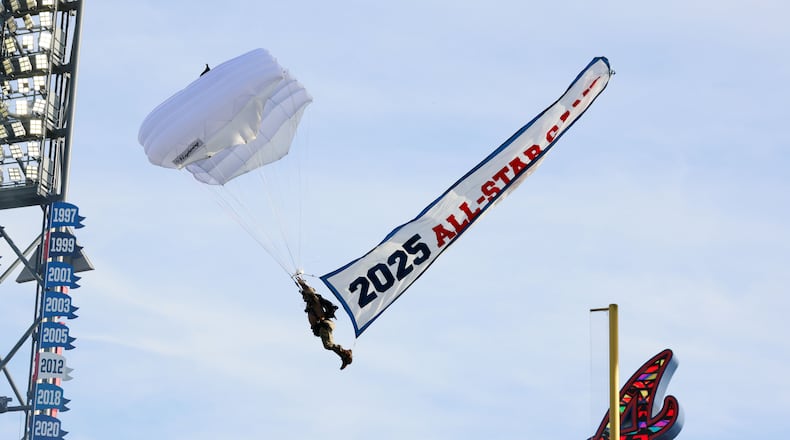A parachute enters Truist Park during the ceremonies for unveiling the All-Star Game logo on Monday, July 22, 2024, in Atlanta.
(Miguel Martinez/ AJC)