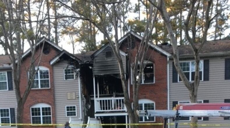 A fire destroyed the roof of an 18-unit condo complex in Roswell, displacing a dozen families.