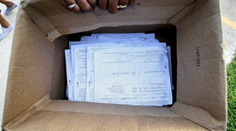 The Atlanta City Council approved an ordinance by a vote of 13-2 on Monday, to ban landlords from rejecting vouchers as payment for affordable housing units. The photo shows a box of applications for housing vouchers. John Spink jspink@ajc.com