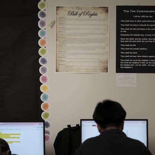 FILE - Students work under Ten Commandments and Bill of Rights posters on display in a classroom at Lehman High School in Kyle, Texas, Thursday, Oct. 16, 2025. (AP Photo/Eric Gay,File)