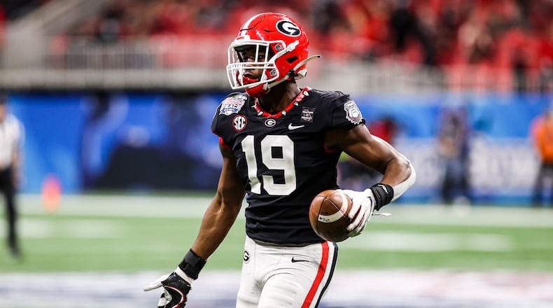 Georgia outside linebacker Adam Anderson runs to the Bulldogs' sideline after his sack and fumble recovery against Cincinnati in the Chick-fil-A Peach Bowl at Mercedes-Benz Stadium in Atlanta on Jan. 1, 2021. The Bulldogs are hoping to keep the senior on the field for more snaps this season. (Photo by Tony Walsh/UGA Athletics)