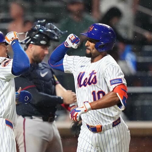 Mets center fielder Tyrone Taylor (left) celebrates with second baseman Marcus Semien after Semien hit a two-run home against the Braves on Monday, July 27, 2026, in New York. (Frank Franklin II/AP)