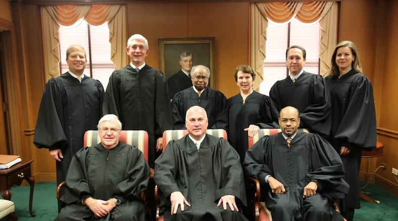 Superior Court Judge Eric Norris (front row, center), when he sat as a visiting state Supreme Court justice because another justice had a conflict of interest. First row (from left to right): then-Chief Justice Harris Hines, Norris and former Justice Harold Melton. Back row (left to right): Justices Nels Peterson and David Nahmias and former Justices Robert Benham, Carol Hunstein, Keith Blackwell and Britt Grant. (Photo: Judgenorris.com)