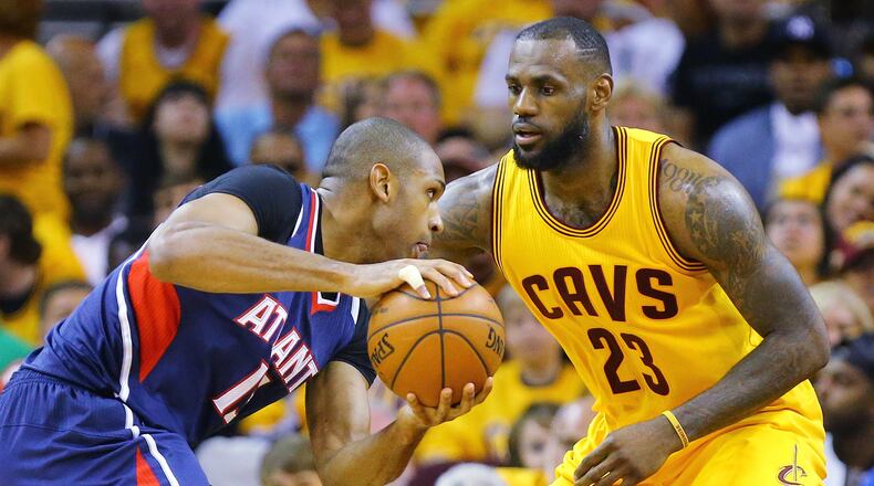 Hawks’ Al Horford looks to drive against Cavaliers’ LeBron James in the Eastern Conference Finals Game 3 on Sunday, May 24, 2015, in Cleveland. Curtis Compton / ccompton@ajc.com