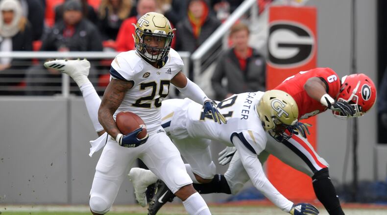November 24, 2018 Athens - Georgia Tech defensive back Juanyeh Thomas (28) runs for one hundred yards touchdown during the second half in a NCAA college football game at Sanford Stadium on Saturday, November 24, 2018. Georgia won 45 - 21 over the Georgia Tech. HYOSUB SHIN / HSHIN@AJC.COM