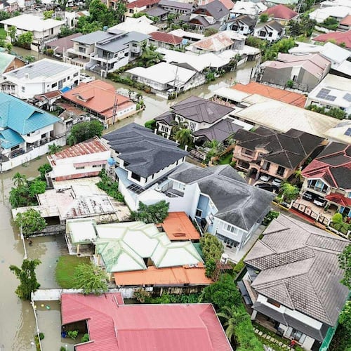 Residential areas are flooded by Typhoon Kalmaegi as it affects Cebu city, central Philippines, Tuesday Nov. 4, 2025. (AP Photo/Jacqueline Hernandez)