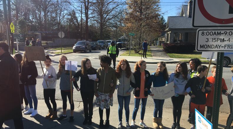 Students form a ring around Inman Middle School in Atlanta. Said Kevin Maxwell, the school principal: "The students had to tell me a specific plan. They had to plan it minute by minute." He said his top job “has nothing to do with acadmics: it is keeping students and staff safe. That's what I think about from the moment they get off the bus in the morning to the moment they leave in the afternoon."