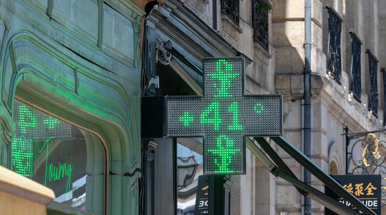 A drugstore sign shows the temperature of 41 degrees Celsius (105,8 degrees Fahrenheit) in Bordeaux, southwestern France, on Tuesday, June 23, 2026, as the national weather service, Meteo France, placed 54 departments, about half the country, under a red heat wave alert. (AP Photo/Caroline Blumberg)