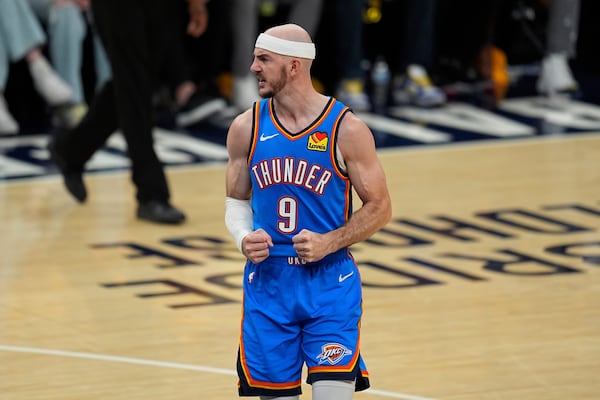 Oklahoma City Thunder guard Alex Caruso (9) celebrates during the second half of Game 4 of the NBA Finals basketball series against the Indiana Pacers, Friday, June 13, 2025, in Indianapolis. (AP Photo/Abbie Parr)