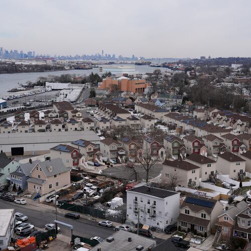 The skyline of lower Manhattan, top left, is seen behind the Staten Island borough of New York, Friday, Jan. 23, 2026. (AP Photo/Seth Wenig)