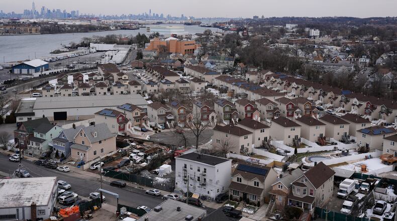 The skyline of lower Manhattan, top left, is seen behind the Staten Island borough of New York, Friday, Jan. 23, 2026. (AP Photo/Seth Wenig)