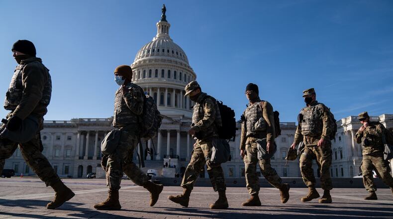 WASHINGTON, DC - JANUARY 14: Members of the National Guard, outside the U.S. Capitol Building - a day after the House of Representatives impeached President Donald Trump, and over a week after a pro-Trump insurrectionist mob breached the security of the nation's capitol - on Thursday, Jan. 14, 2021 in Washington, DC. (Kent Nishimura / Los Angeles Times/TNS)