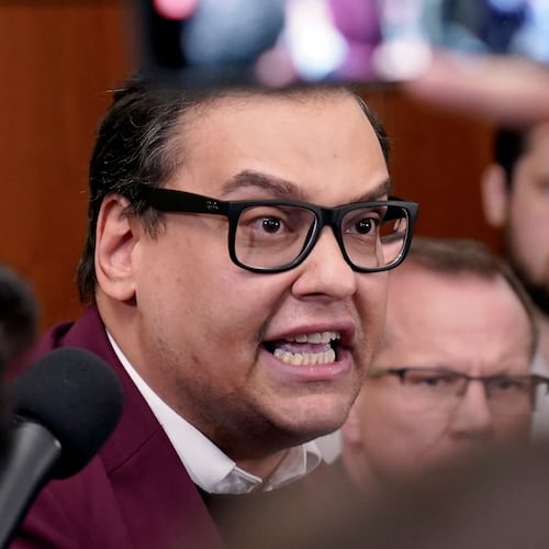 FILE - Rep. George Santos, R-N.Y., talks to reporters as House Republicans hold a caucus meeting at the Capitol in Washington, Oct. 13, 2023. (AP Photo/Mariam Zuhaib, file)