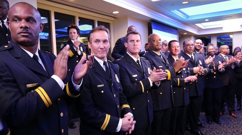 Atlanta Police Chief Erika Shields (second from left) introduces her command staff after taking her oath of office Jan. 10. Curtis Compton/ccompton@ajc.com