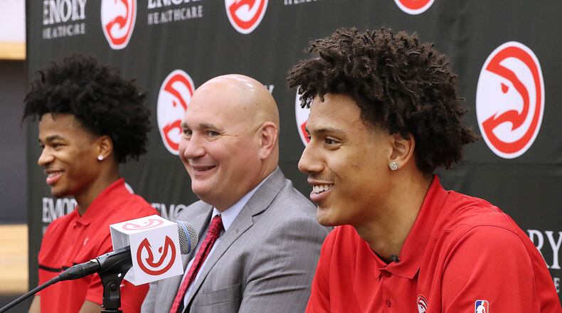 Atlanta Hawks President of Basketball Operations and General Manager Travis Schlenk (center), Jalen Johnson (right, 20th overall pick) and Sharife Cooper (left, 48th overall pick) share a laugh during their introduction on Friday, July 30, 2021, in Atlanta.  Curtis Compton / Curtis.Compton@ajc.com